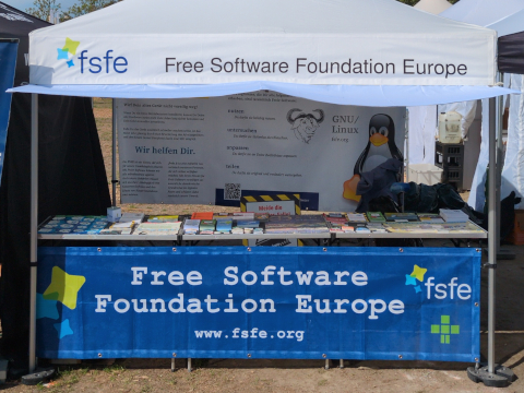 A frontal view of our FSFE information desk at the Veganmania summer festival danube island 2026